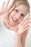 Happy woman with hands framing face