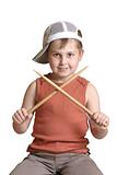 Boy with wooden drumsticks crossed.