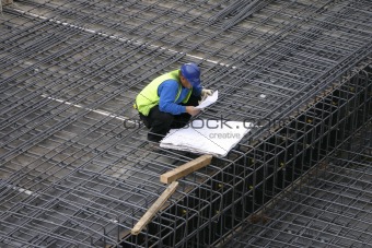 Project Manager reading the site plans