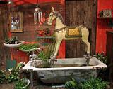 Antique wooden horse set in old bathtub