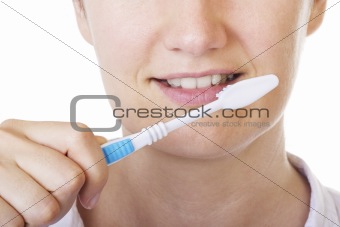 Lady brushing teeth