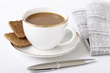Business breakfast composition: coffee, newspaper, fountain pen