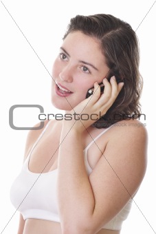 Young lady in crop top talking on her mobile phone