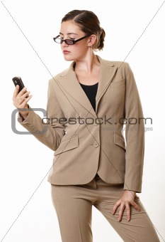Businesswoman with sunglasses looking at mobile phone