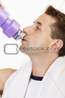 Close up of male drinking after exercising