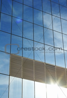 office building with reflection of sky