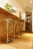 wooden bar with crome stools 