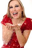 Woman blowing soft flakes