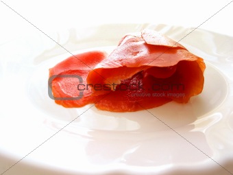 Smoked salmon on white plate