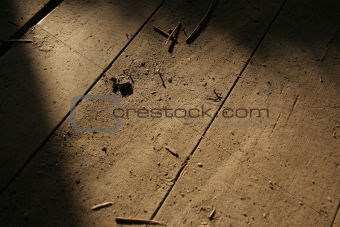 Detail of wooden floor with debris