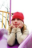 Girl on playground thinking