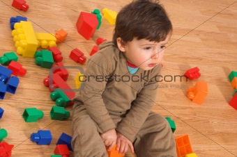 baby playing in empty room