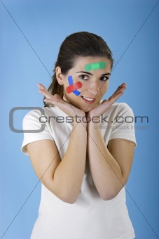 Woman with bandages on the face
