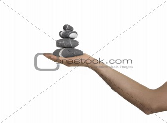 Balanced stones on a man Hand