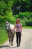 Girl walk pony
