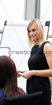 Beautiful businesswoman giving a presentation