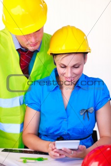 Female and male with hard hat working 