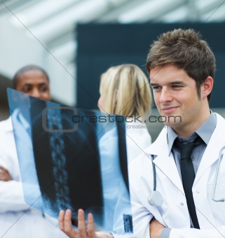 Young doctor looking at an x-ray