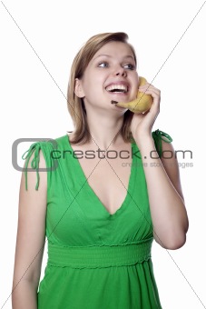 girl holds banana as a phone