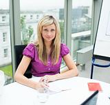 Confident beautiful businesswoman working in office
