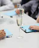 Businesspeople drinking champagne in office
