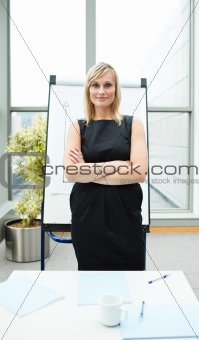 Confident isolated businesswoman in office