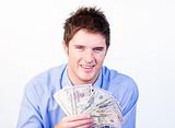 Young businessman showing dollars 