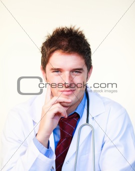 Friendly young doctor looking at the camera