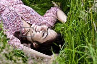 Cute Girl Lying On Grass