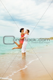 Laughing couple at the beach