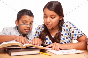 Hispanic Brother and Sister Having Fun Studying Together Isolated on a White Background.