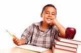 Adorable Hispanic Boy with Books, Apple, Pencil and Paper Isolated on a White Background.