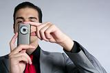 Businessman taking photos with phone camera