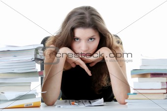 Young and pretty female student with books 