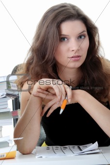 Young and pretty female student with books 