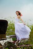 beautiful bride and old  carriage