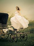 beautiful bride and old  carriage / retro style toned