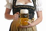 Bavarian Woman in Dirndl holds Beer stein at Oktoberfest