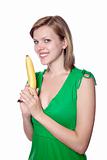 girl holds banana as a gun