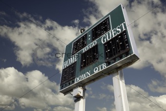 HIgh School Scoreboard with a Beautiful Sky and Clouds Background.