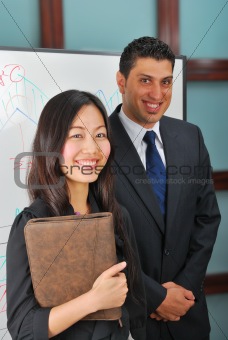 young woman and man at whiteboard