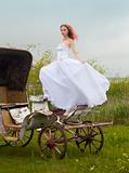 beautiful bride and old  carriage