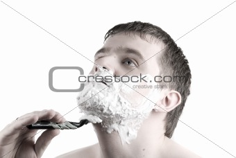 Shaving  Man with razor and foam
