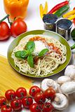 Spaghetti, tomato, cheese and basil