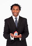 Friendly businessman showing constructions of house 
