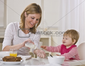 Mother and Daughter Eating Breakfast