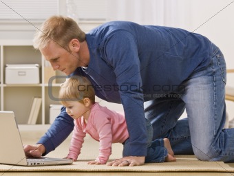 Father and Daughter with Laptop