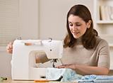 Woman Using Sewing Machine