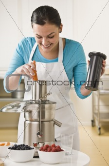 Woman Using Juicer