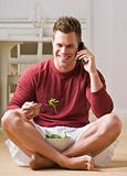 Man With Cell Phone and Salad